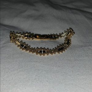 Gold bracelet w/ black beads